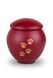 Brown pet urn with gold colored paws
