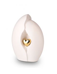White ceramic cremation urn with gold-coloured heart