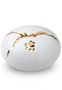 White pet urn 'Kintsugi' with gold-colored paw