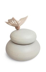 Natural colored handmade cremation urn with wooden butterfly