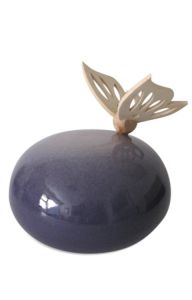 Handmade purple ceramic funeral urn with wooden butterfly