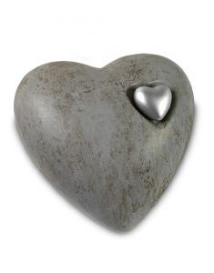 Grey cremation urn for ashes with silver colored heart