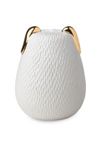 Dog urn for ashes with gold colored ears