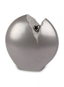 Ceramic cremation ashes urn with grey crack and silver heart