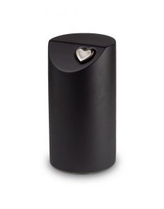 Black cremation urn with silver coloured heart