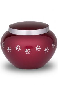 Red pet urn with silver colored pawprints | Medium